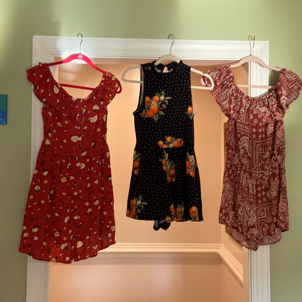 2 Rompers and 1 short dress.